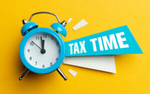 An alarm clock telling the viewer it's tax time