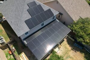 South Texas home with a large solar panel system on its roof and patio.