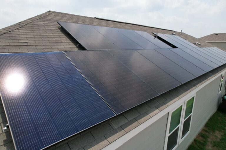 top side view of 1-story home with solar panels